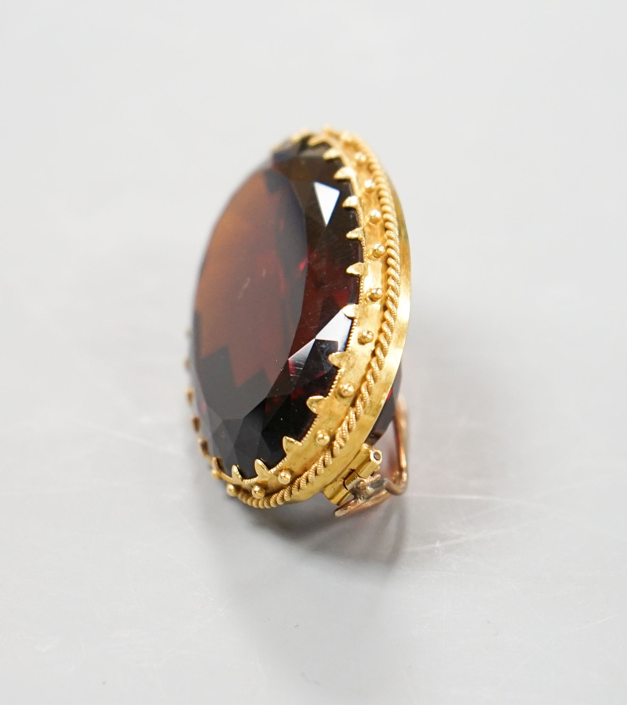 A large yellow metal mounted dark citrine brooch, 48mm, gross weight 37.9 grams.